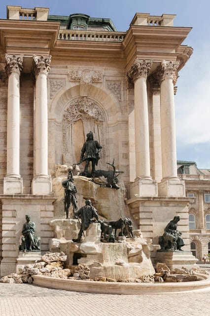 Budapest: Buda Castle Walking Tour & Folk Music Performance - Starting beneath the Holy Trinity Statue