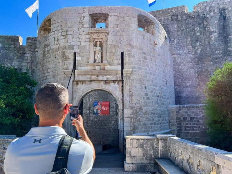 Dubrovnik: City Walls, Old Town Walking Tour & Adriatic View - Luža Square and the Clock Tower show Dubrovnik in motion