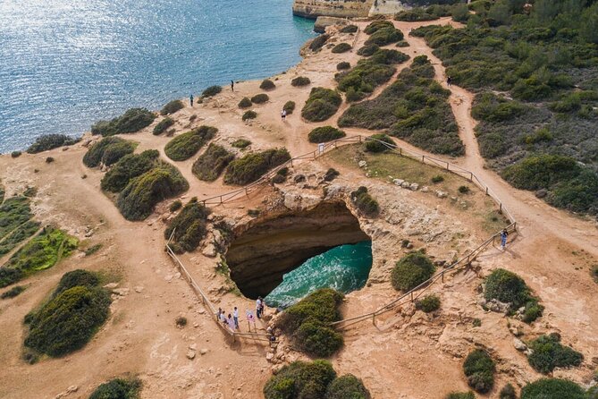 From Albufeira: Benagil Tour, Bones & Medieval Silves Castle - Praia de Nossa Senhora da Rocha and its cliff chapel