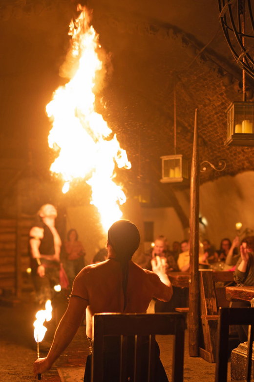 From Prague: Medieval Dinner, Show, Castle and Brewery - Music, dancers, a juggler, and fire