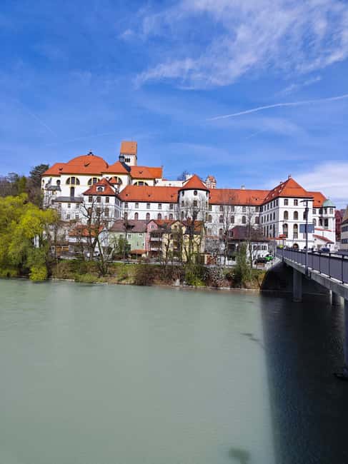 Füssen to Neuschwanstein Castle - Guided Scenic Tour - Alpsee brings water and mountain views