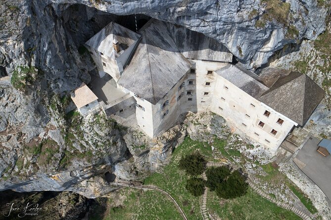 Ljubljana: Postojna cave & Predjama castle small group tour - Predjama Castle, built into a cliff