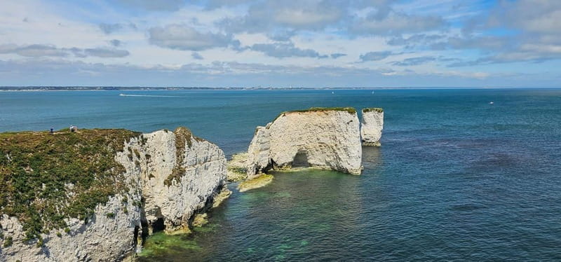 Poole: Old Harry Rocks and Corfé Castle Guided E-bike Tour - Sandbanks brings the first big beach view