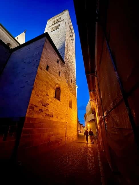 Prague: Night Walk through Prague Castle with City Views - Old Royal Palace, Saint George’s Basilica, and the castle complex