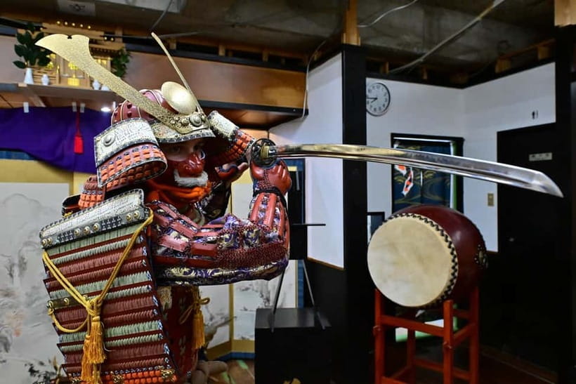 Samurai Armor & Sword experience with phot near Osaka Castle - Putting on armor and taking the portrait